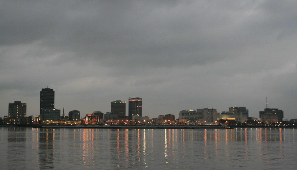 Light reflections from downtown Baton Rouge reach across the Mississippi River on Saturday, Feb. 12, 2023, toward the banks of Port Allen, La.