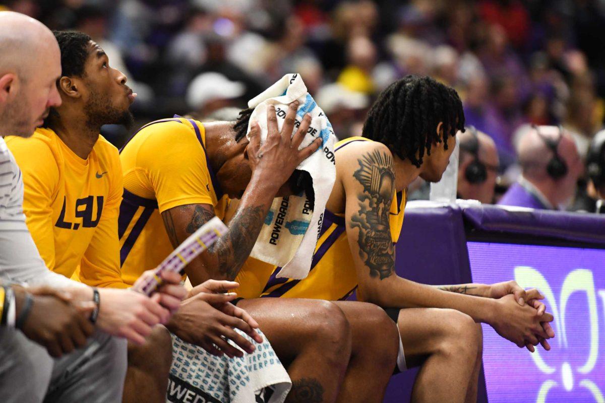 LSU men&#8217;s basketball junior forward Derek Fountain (20) puts his head in his hands on the bench on Saturday, Feb. 11, 2023, during LSU&#8217;s 74-62 loss to Texas A&amp;M at the Pete Maravich Assembly Center in Baton Rouge, La.