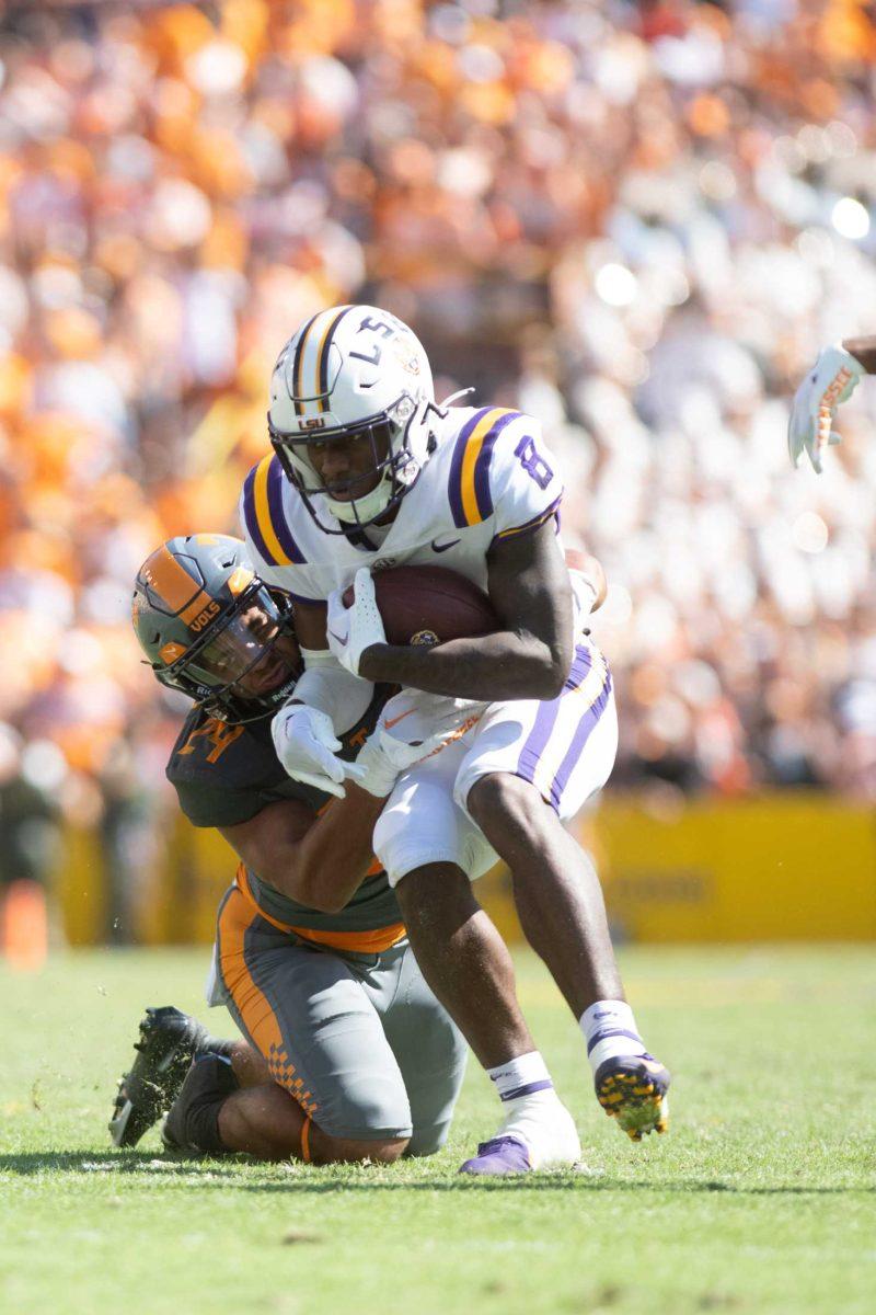 LSU sophomore wide receiver Malik Nabers (8) attempts to avoid a tackle on Saturday, Oct. 8, 2022, during LSU's defeat to Tennessee 13-40 in Tiger Stadium.