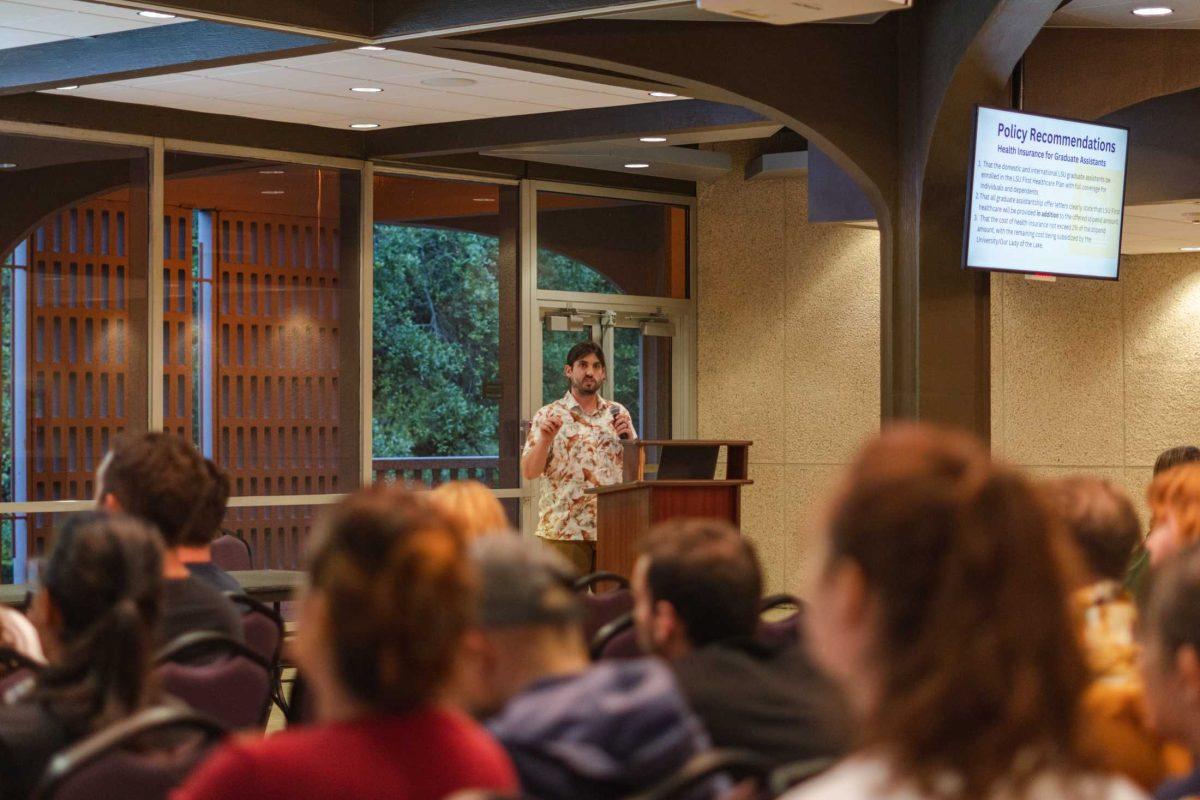 <p>LSU graduate student Cullen Hodges presents the findings of the Committee on the Graduate Student Healthcare Crisis on Thursday, March 30, 2023, inside the Student Union in Baton Rouge, La.</p>