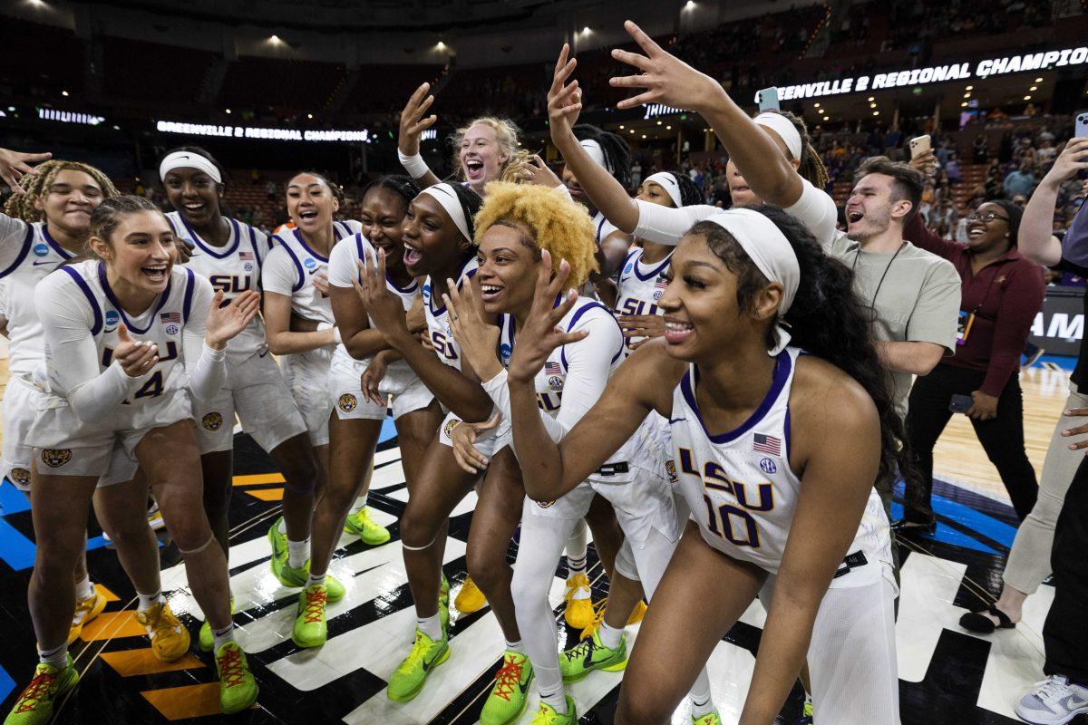 LSU's Angel Reese (10) celebrates with teammates after defeating Miami in an Elite 8 college basketball game to earn a trip to the Final 4 of the NCAA Tournament in Greenville, S.C., Sunday, March 26, 2023. (AP Photo/Mic Smith)