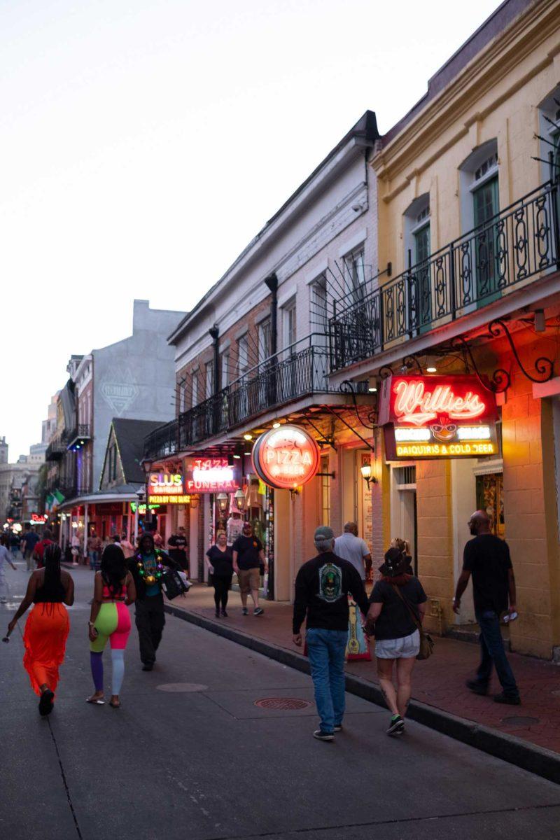 Neon signs light the French Quarter's Bourbon Street at dusk on Saturday, March 4, 2023, in New Orleans, La. Kirsten Stimmel's father, Carl Stimmel, played gigs as a drummer in the Quarter during the 1950's.