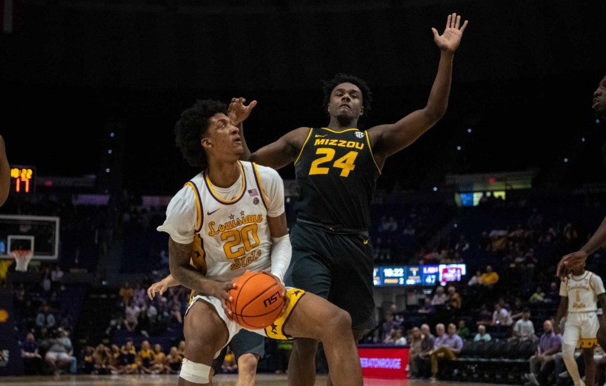 LSU men&#8217;s basketball junior forward Derek Fountain (20) attempts to dodge his defender on Wednesday, March 1, 2023, during LSU&#8217;s&#160;81-76 loss against Missouri in the Pete Maravich Assembly Center in Baton Rouge, La.