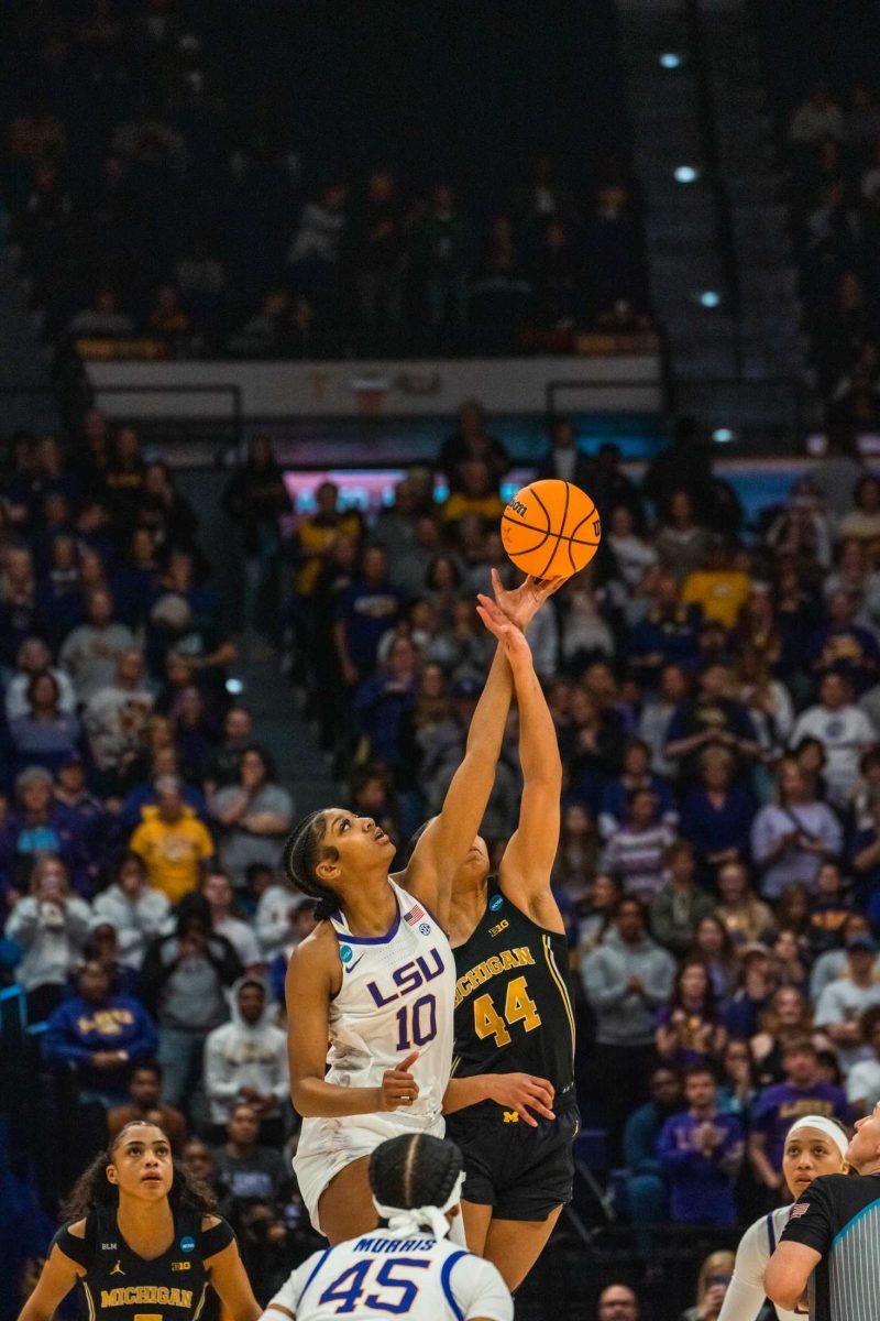 LSU women's basketball sophomore forward Angel Reese (10) grabs the ball in the toss up during their 66-42 win against Michigan in the second round of March Madness Sunday, March 19, 2023, at the Pete Maravich Assembly Center on N. Stadium Drive in Baton Rouge, La.