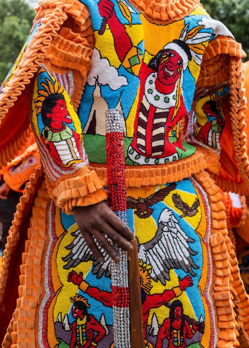 A Mardi Gras Indian of the Red Cheyenne tribe dances with a decorative rifle on Super Sunday,&#160;March 19, 2023, in A.L. Davis Park in New Orleans, La.