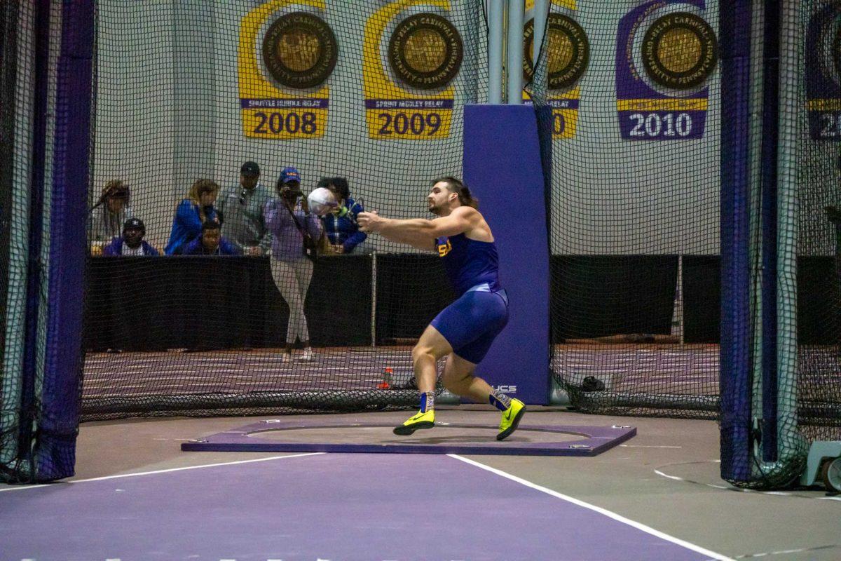 LSU men's track and field junior thrower Luke Witte preforms a throw at the LSU twilight meet during the weight throw event on Friday, Feb. 17, 2023, at the Carl Maddox Field House in Baton Rouge, La.