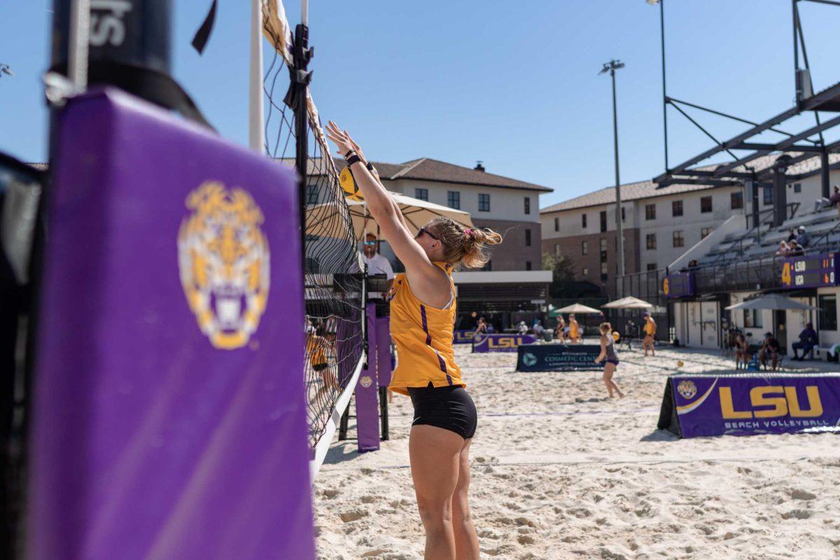 <p>LSU beach volleyball junior Amber Haynes (12) tries to block the ball on Sunday, March 5, 2023, during LSU’s 5-0 win against North Alabama at the Beach Volleyball Stadium on Cypress Drive in Baton Rouge, La.</p>