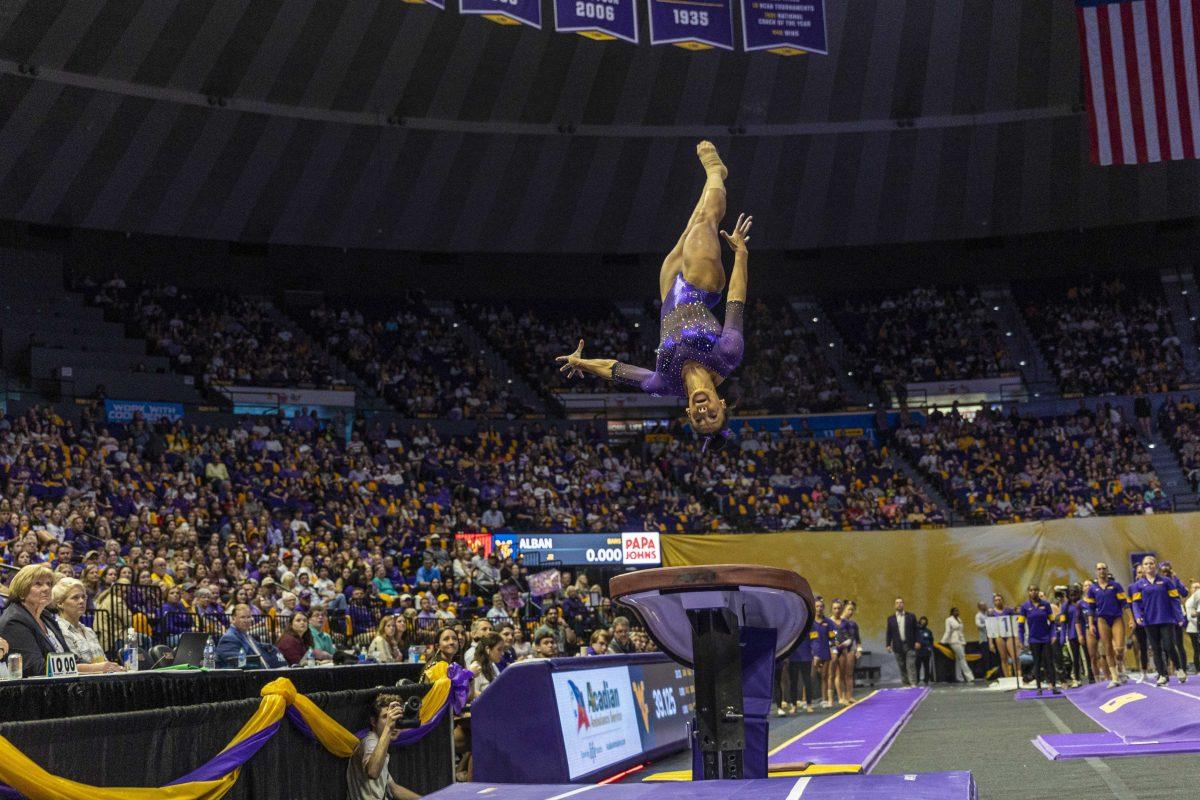 LSU gymnastics all-around junior Haleigh Bryant dives through the air Friday, March 10, 2023, during LSU's 198.025-196.450 victory over West Virginia in the Pete Maravich Assembly Center in Baton Rouge, La.