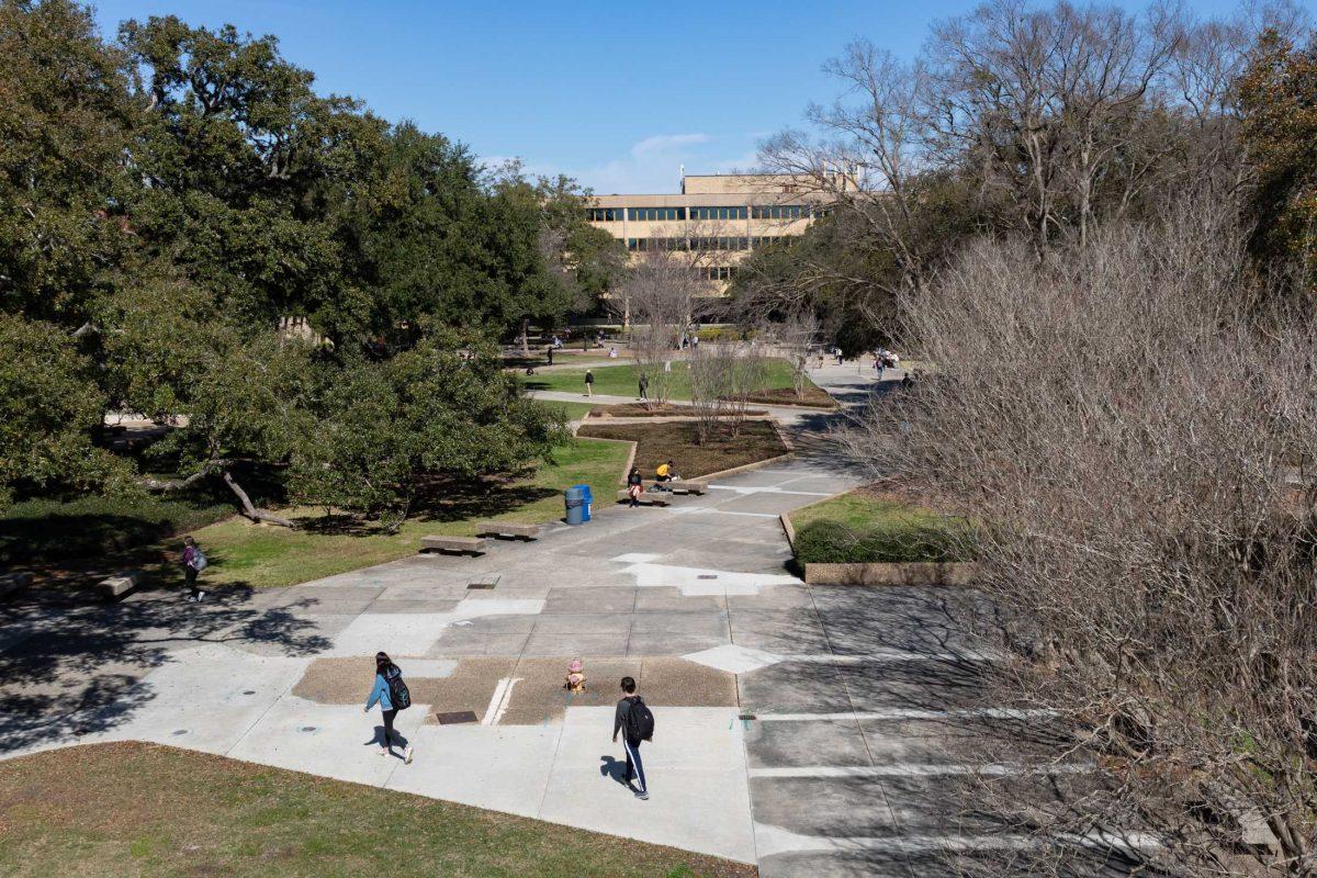 Students stroll and sit Monday, Feb. 13, throughout the LSU Quad in Baton Rouge, La.