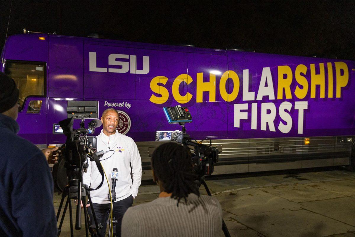 LSU President William F. Tate IV conducts interviews March 13 prior to the departure of the Scholarship First bus tour.