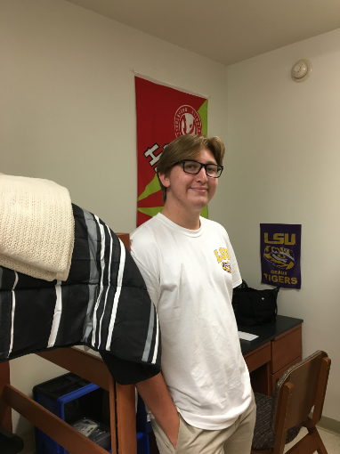 Max Gruver stands in his South Hall dorm room.