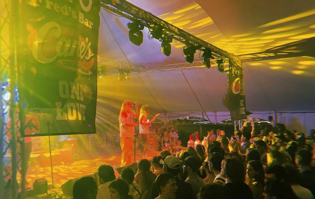 Performers sing on stage at Fred's Bar in Tigerland on September 18, 2022.