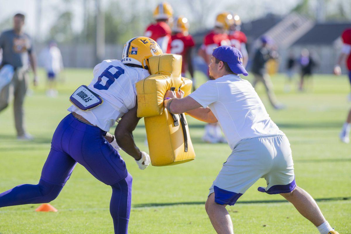 LSU football wide receiver Malik Nabers (8) runs a drill Thursday, April 7, 2022, during LSU&#8217;s spring practice in Baton Rouge, Louisiana.