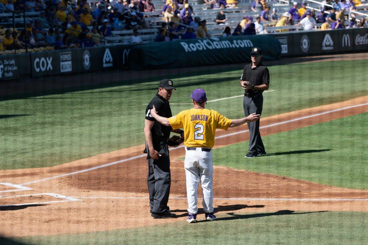 LSU baseball head coach Jay Johnson speaks to the umpires Sunday, March 5, 2023, as they deliberate during LSU baseball's 13-0 victory over Central Connecticut State at Alex Box Stadium in Baton Rouge, La.