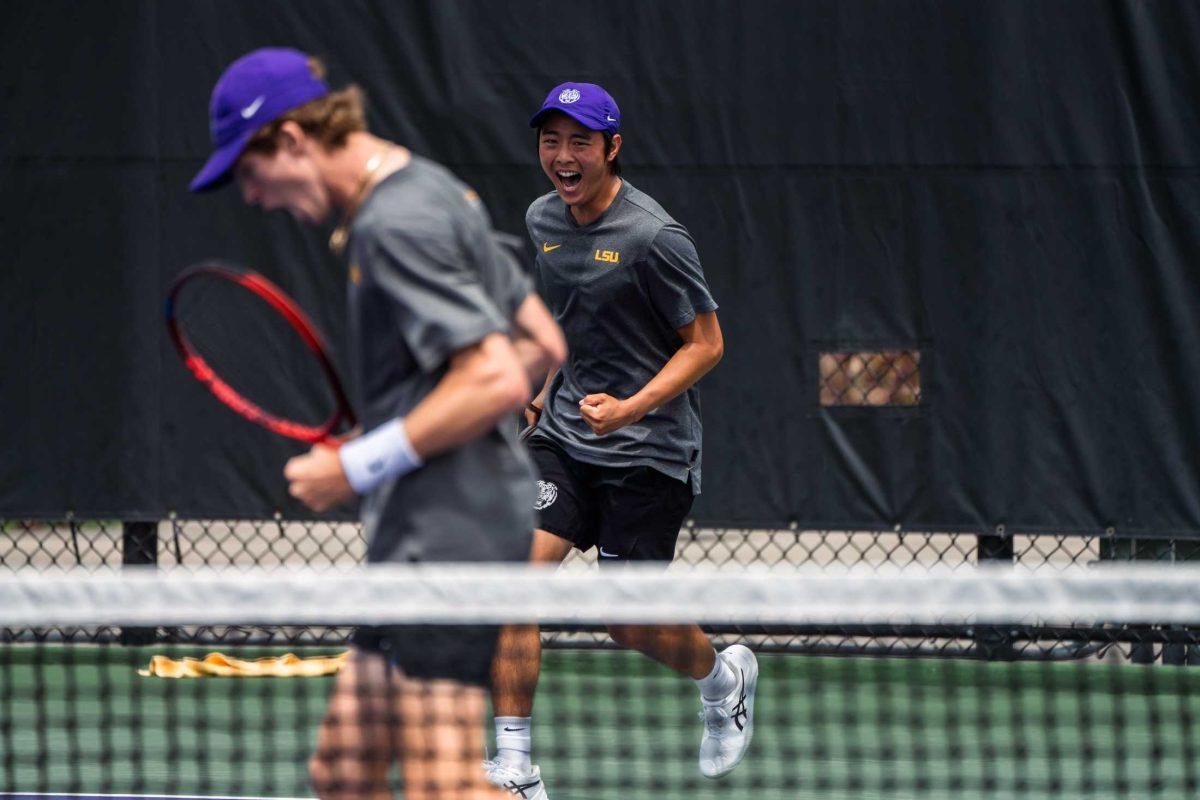 LSU men's tennis juniors Welsh Hotard and Chen Dong celebrate a point during their 7-5 win against Alabama Sunday, March 26, 2023, at the LSU tennis complex on Gourrier Avenue in Baton Rouge, La.