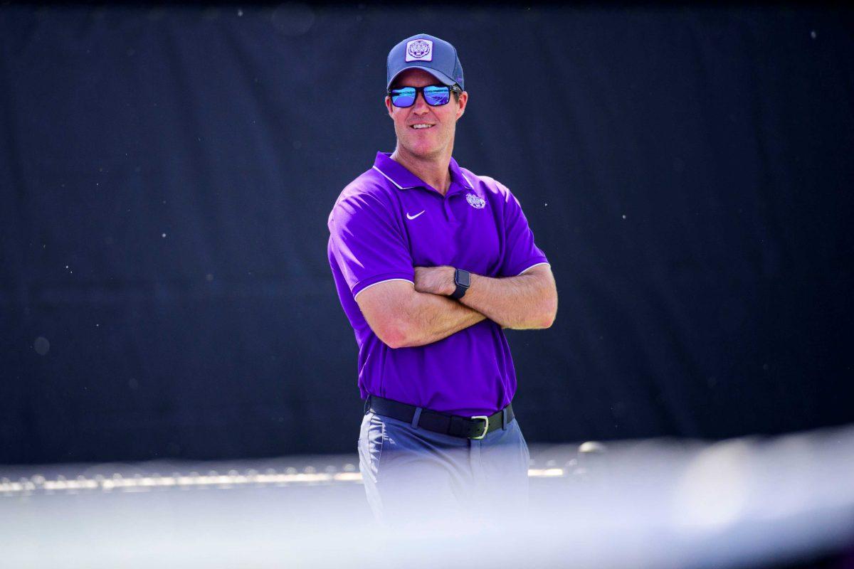 Danny Bryan stands and watches as his team competes (Photo courtesy of LSU Athletics).