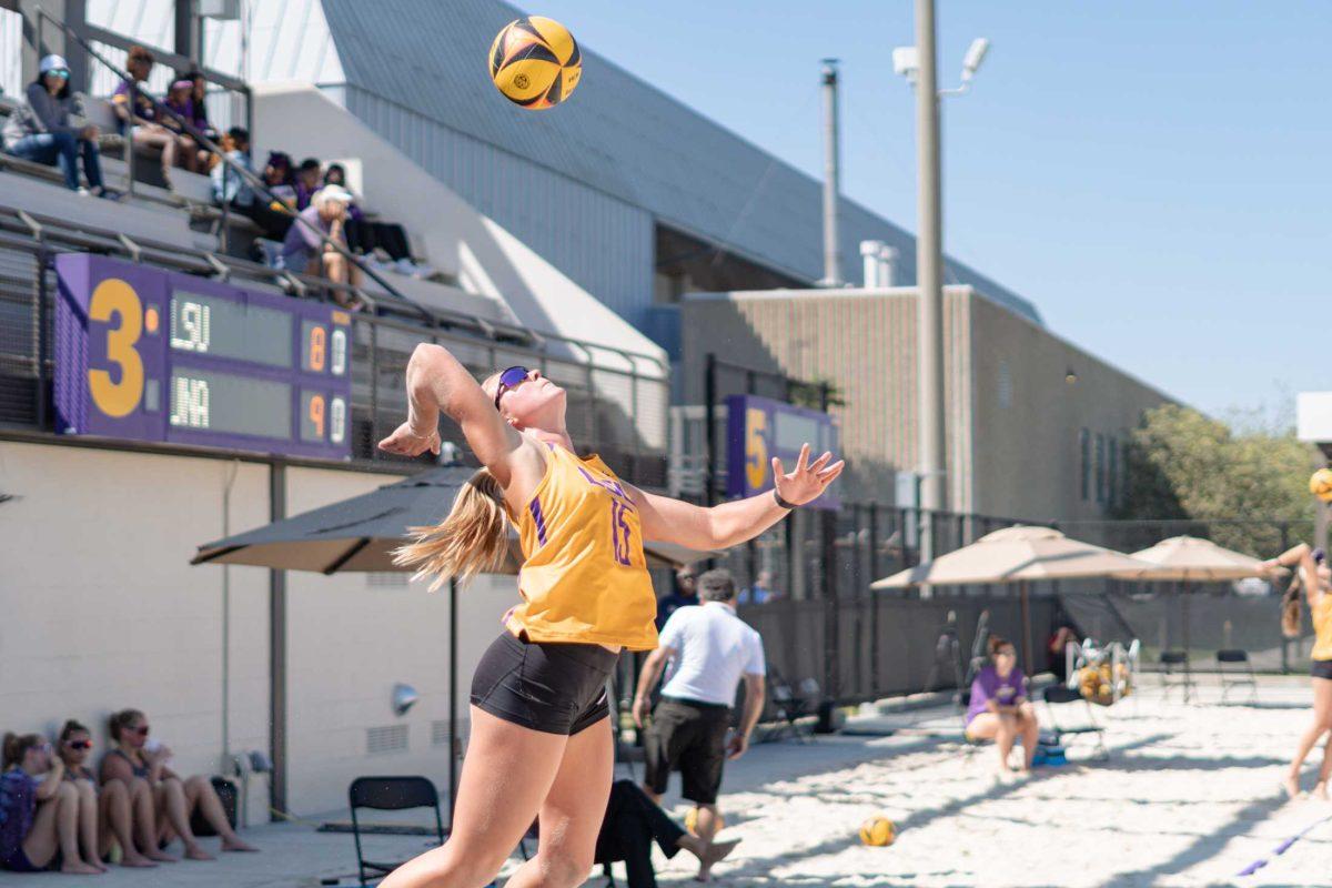 LSU beach volleyball junior Ellie Shank (15) serves the ball on Sunday, March 5, 2023, during LSU&#8217;s 5-0 win against North Alabama at the Beach Volleyball Stadium on Cypress Drive in Baton Rouge, La.