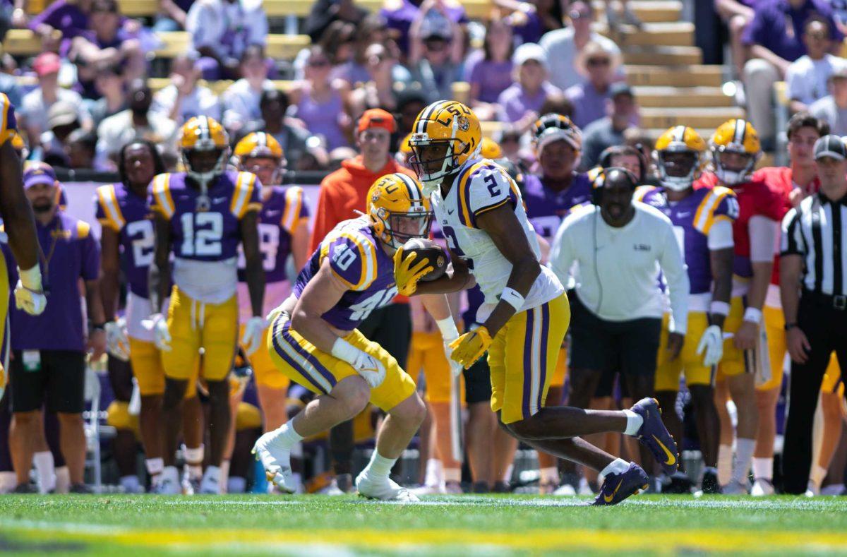 LSU football senior wide receiver Kyren Lacy (2) gains yards on the play on Saturday, April 22, 2023, during LSU&#8217;s 32-32 tie during the spring game in Tiger Stadium in Baton Rouge, La.