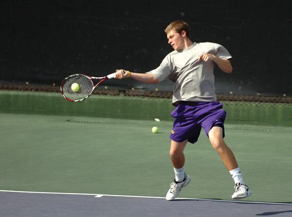 Freshman Neal Skupski, a native of Liverpool, England, volleys the ball back to his opponent Friday during the Tigers&#8217; match against Auburn University. LSU lost the match, 4-3. Skupski is one of six men&#8217;s tennis players from outside the United States.