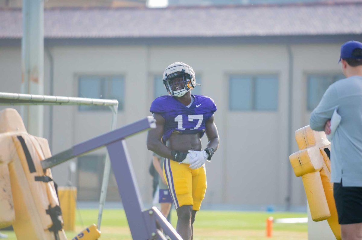 LSU football senior defensive end Ovie Oghoufo (17) smiles on Tuesday, April 18, 2023, at the Charles McClendon Practice Facility in Baton Rouge, La.