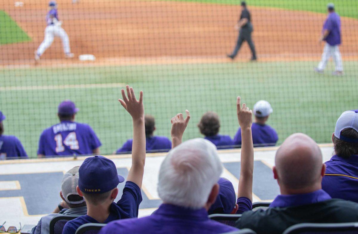 LSU baseball fans cheer after LSU baseball junior first baseman Tre' Morgan hit a triple on Friday, March 24, 2023, during LSU's 3-9 loss against Arkansas in Alex Box Stadium in Baton Rouge, La.