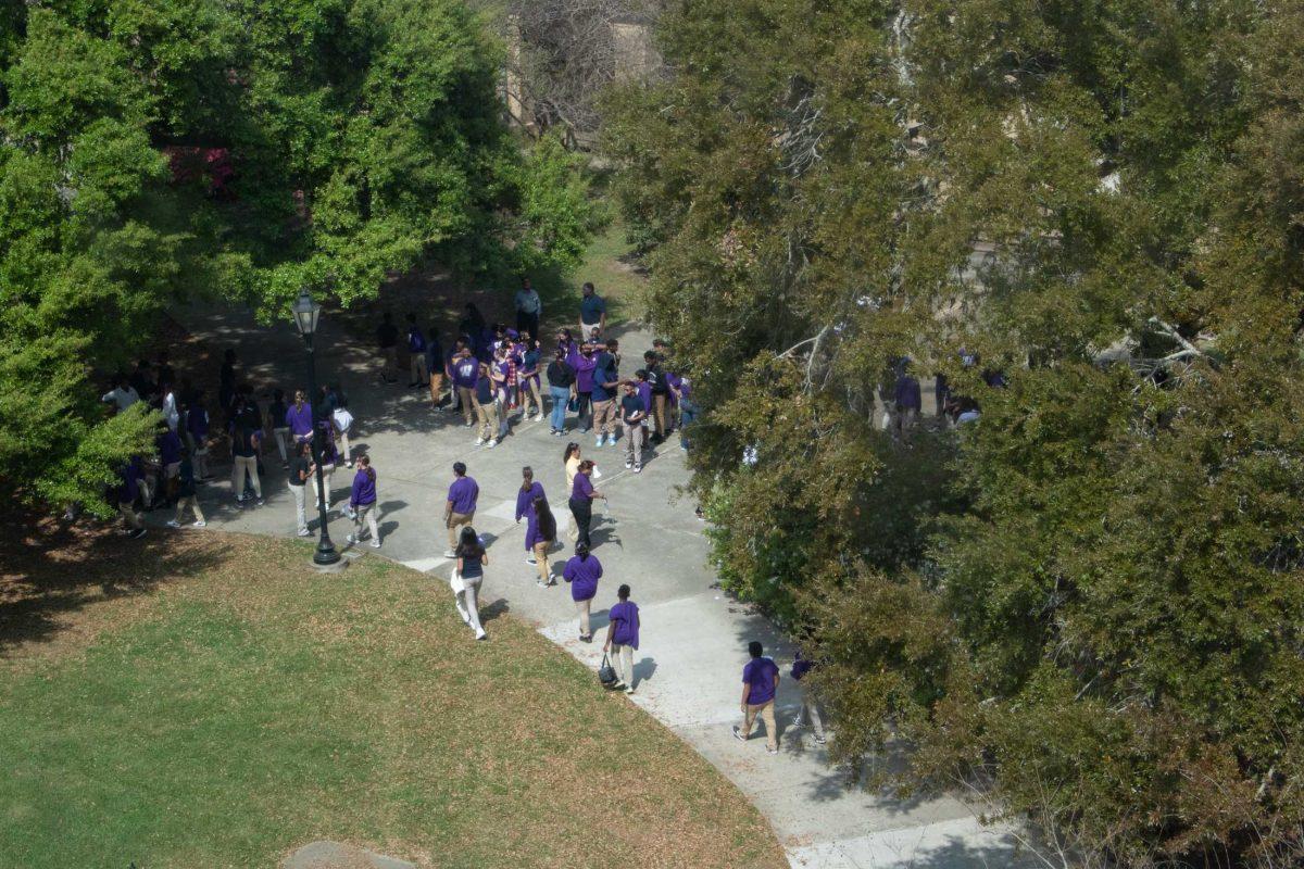 A tour group walks Tuesday, March 7, 2023, through the courtyard between Murphy J. Foster Hall and the LSU Library in Baton Rouge, La.