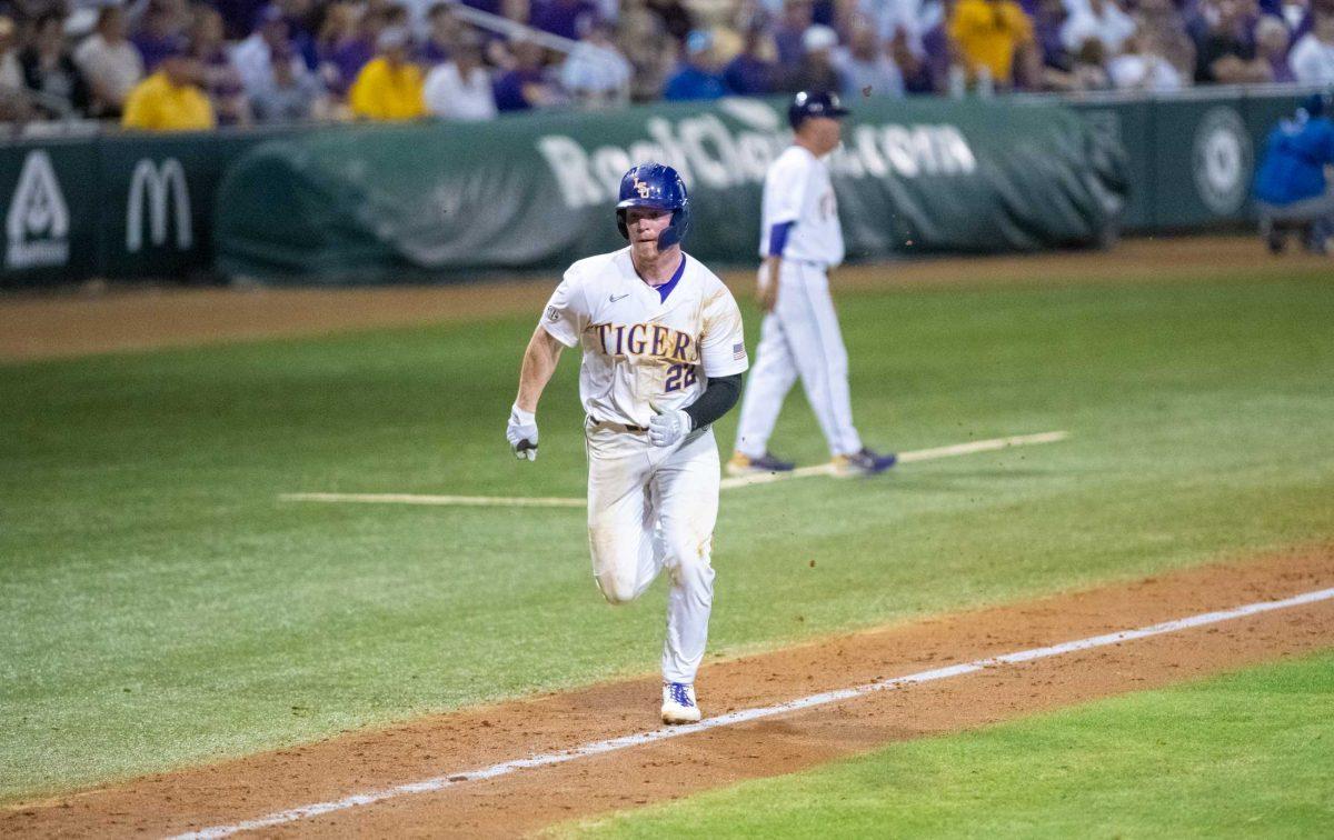 LSU baseball freshman catcher/first baseman Jared Jones (22) runs toward home plate on Friday, April 14, 2023, during LSU&#8217;s 13-10 loss against Kentucky in Baton Rouge, La.