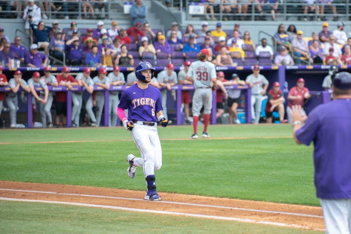 LSU baseball redshirt junior outfielder Brayden Jobert (6) runs to first base on Friday, March 24, 2023, during LSU's 3-9 loss against Arkansas in Alex Box Stadium in Baton Rouge, La.