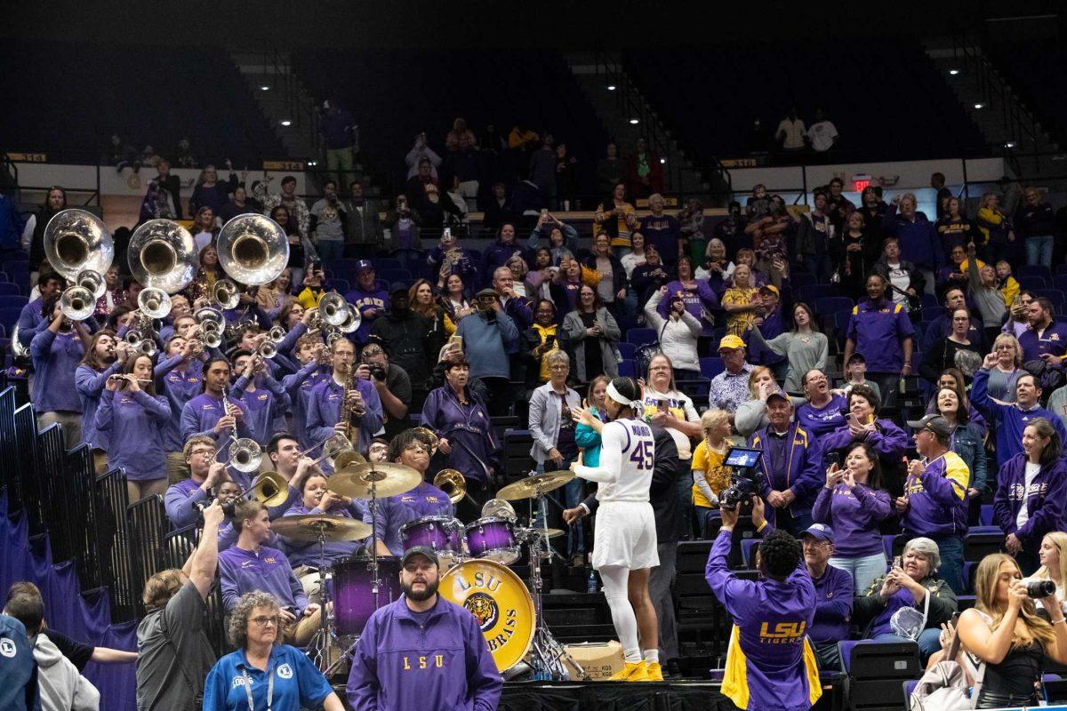 LSU women&#8217;s basketball 5th-year senior guard Alexis Morris (45) conducts the LSU Bengal Brass Basketball Band Friday, March 17, 2023, after LSU&#8217;s 73-50 win against Hawaii at the Pete Maravich Assembly Center in Baton Rouge, La.