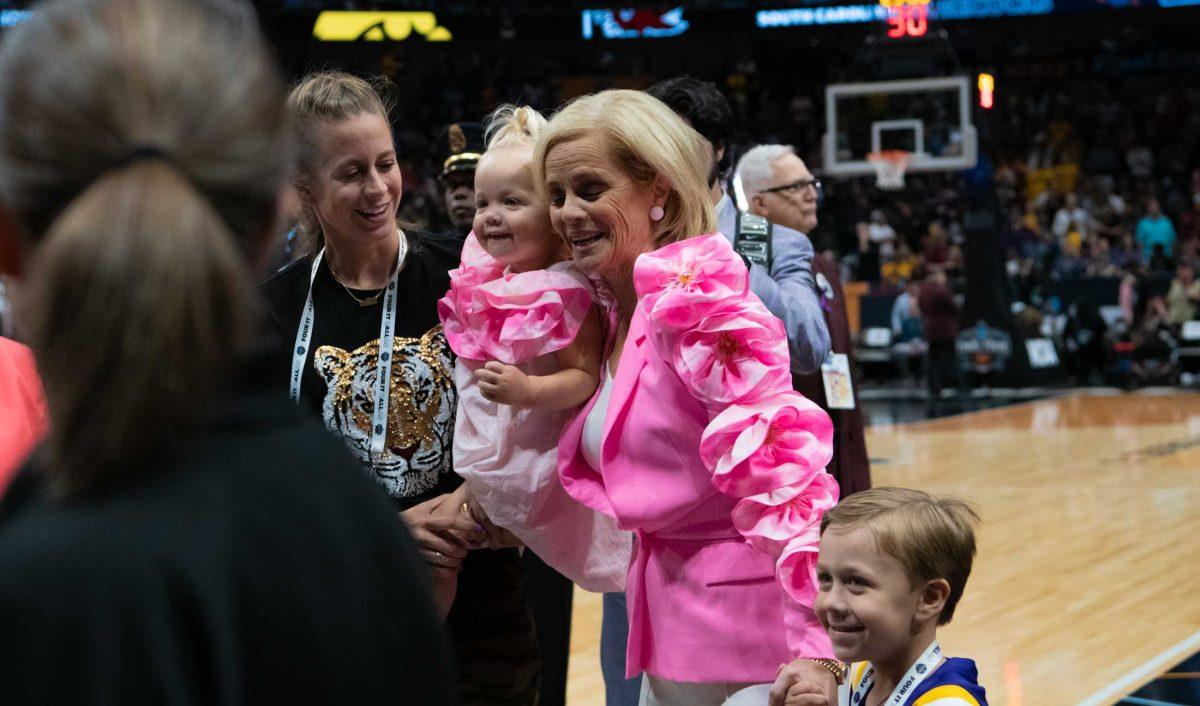 LSU women&#8217;s basketball head coach Kim Mulkey celebrates with her family on Friday, March 31, 2023, after LSU&#8217;s 79-72 victory over Virginia Tech in the NCAA Final Four in the American Airlines Center in Dallas, Texas.