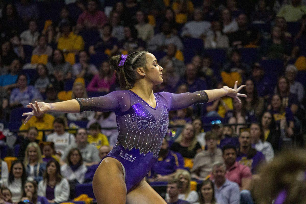 LSU gymnastics all-around Aleah Finnegan poses on the balance beam Friday, March 10, 2023, during LSU's 198.025-196.450 victory over West Virginia in the Pete Maravich Assembly Center in Baton Rouge, La.