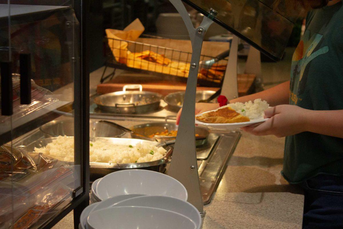 A student makes their plate from the vegetarian options on Monday, Oct. 3, 2022, in The 5 Dining Hall in Baton Rouge, La.