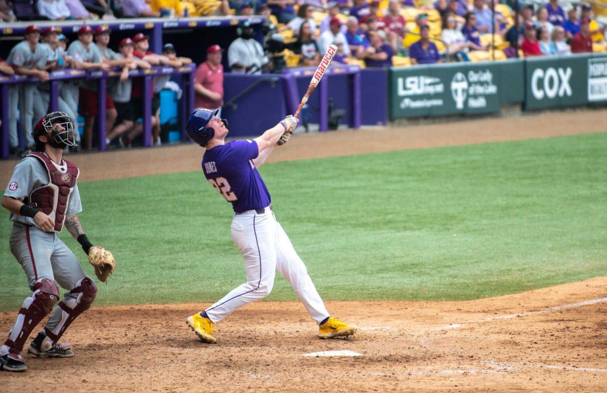 LSU baseball freshman catcher/first baseman Jared Jones (22) looks at a pop-up ball on Friday, March 24, 2023, during LSU's 3-9 loss against Arkansas in Alex Box Stadium in Baton Rouge, La.