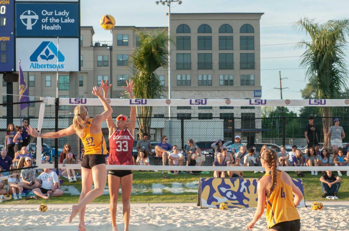 <p>LSU beach volleyball junior Amber Haynes (12) reaches for the ball during LSU's 3-2 loss against Stanford Friday, April 15, 2023, at the LSU Beach Volleyball Stadium in Baton Rouge.</p>