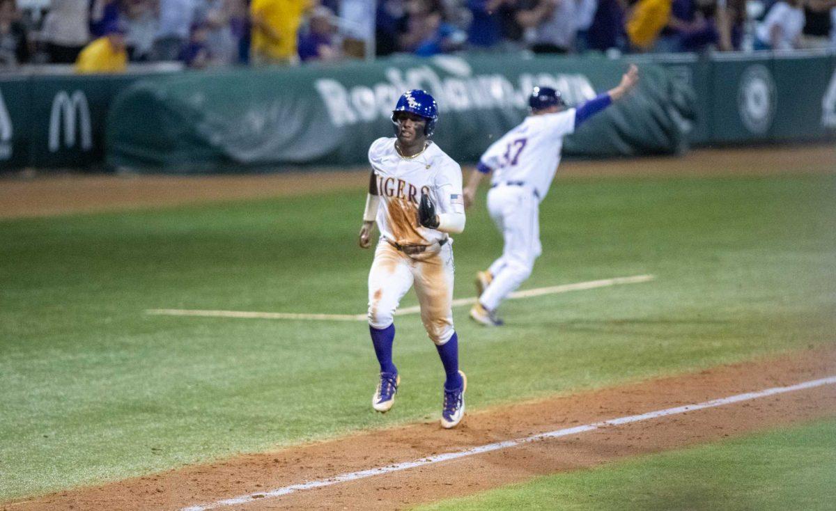 LSU baseball junior first baseman Tre&#8217; Morgan (18) runs toward home base on Friday, April 14, 2023, during LSU&#8217;s 13-10 loss against Kentucky in Baton Rouge, La.