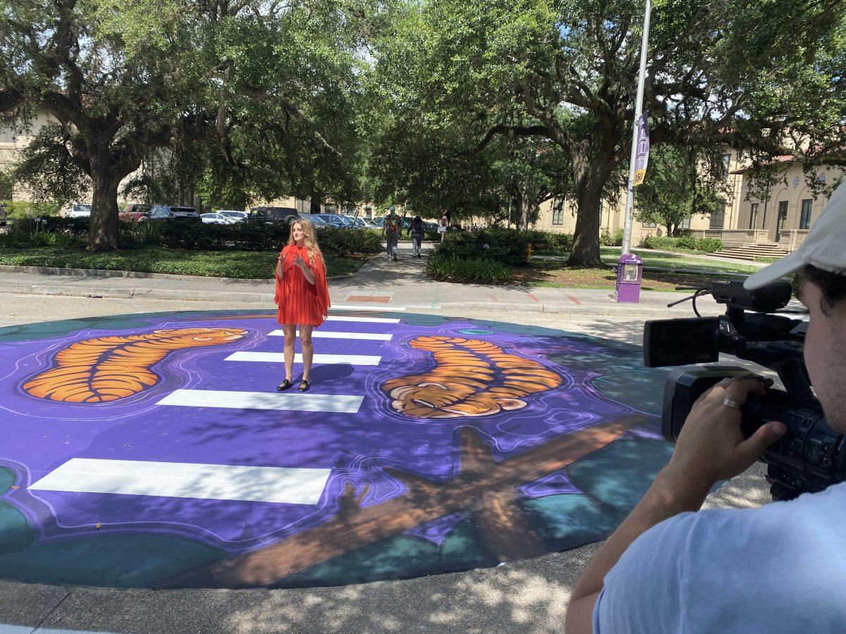 LSU political communications senior Isabella Matthews stands on the creative crosswalk while talking to media.&#160;