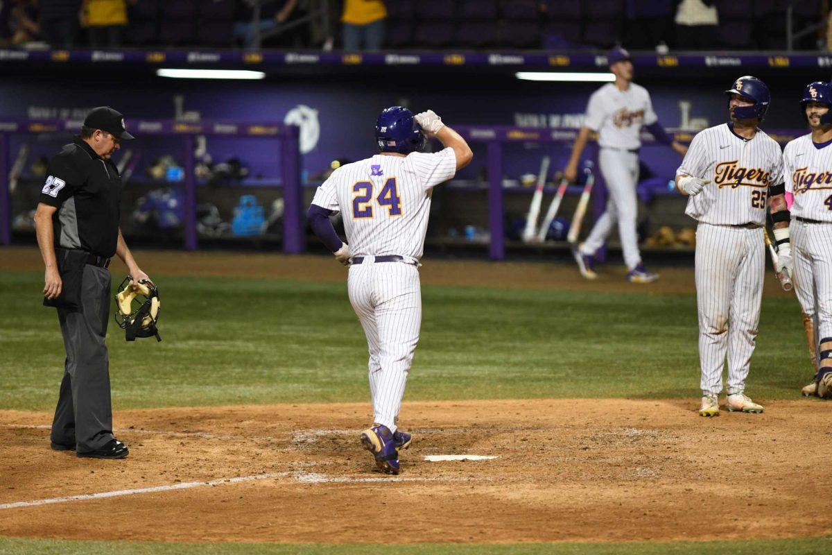 LSU baseball graduate student first baseman Cade Beloso (24) runs home on Tuesday, April 25, 2023, during LSU&#8217;s 6-5 loss to Nicholls at Alex Box Stadium in Baton Rouge, La.