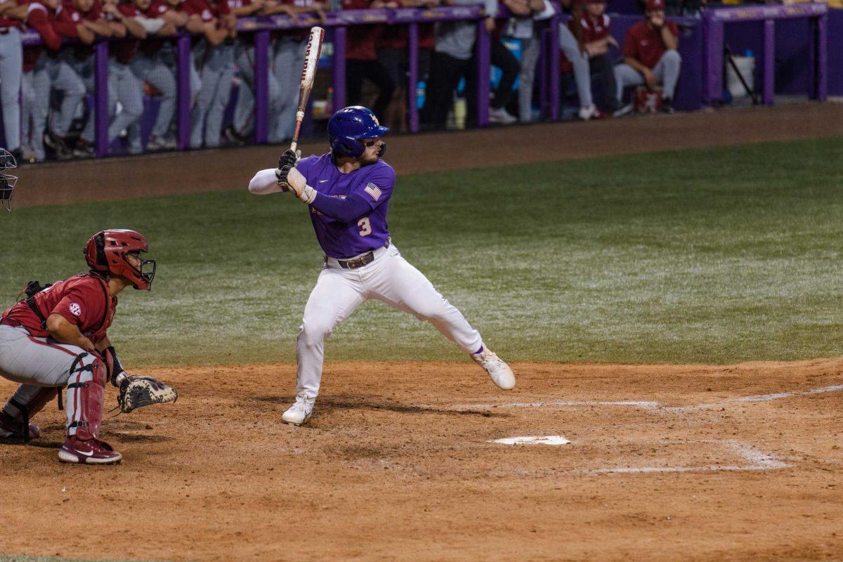 LSU baseball junior outfielder Dylan Crews (3) readies to swing on Friday, April 28, 2023, during LSU&#8217;s 8-6 win over Alabama at Alex Box Stadium in Baton Rouge, La.