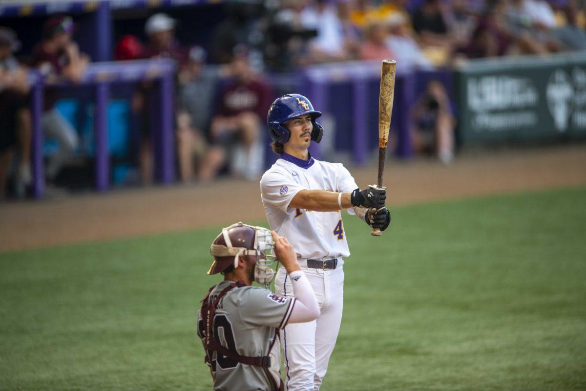 LSU baseball junior infielder Jordan Thompson (4) inspects his bat Saturday, May 13, 2023, during LSU's 9-4 loss to Mississippi State at Alex Box Stadium in Baton Rouge, La.