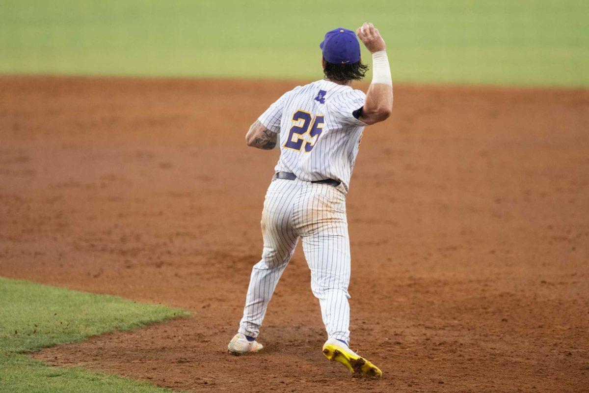 LSU baseball redshirt junior catcher Hayden Travinski (25) throws the ball to second base Tuesday, May 16, 2023, during LSU&#8217;s 7-4 win against McNeese State University at Alex Box Stadium in Baton Rouge, La.