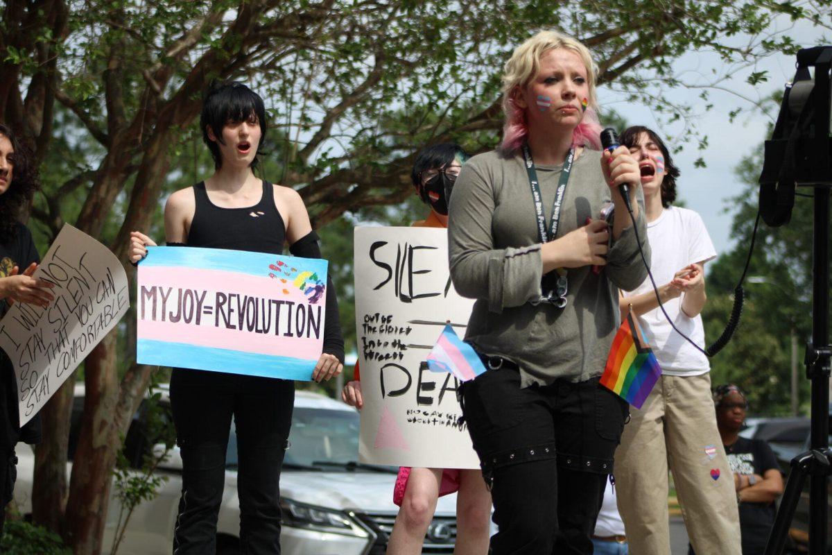 Students at Ben Franklin High School in New Orleans cheer for Camille Sejud, front, while she spoke to hundreds of students Friday, March 31, 2023, for Transgender Day of Visibility.