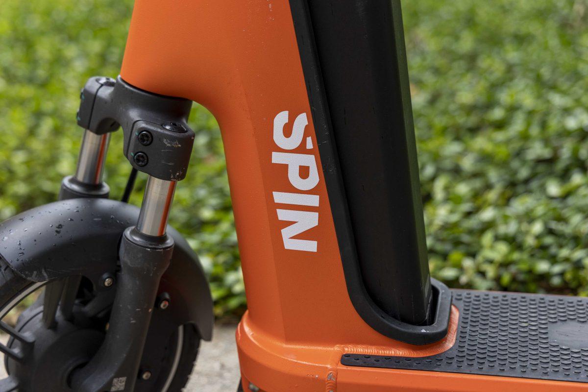 A SPIN scooter sits Monday, April 24, 2023 in front of Coates Hall on LSU's campus.