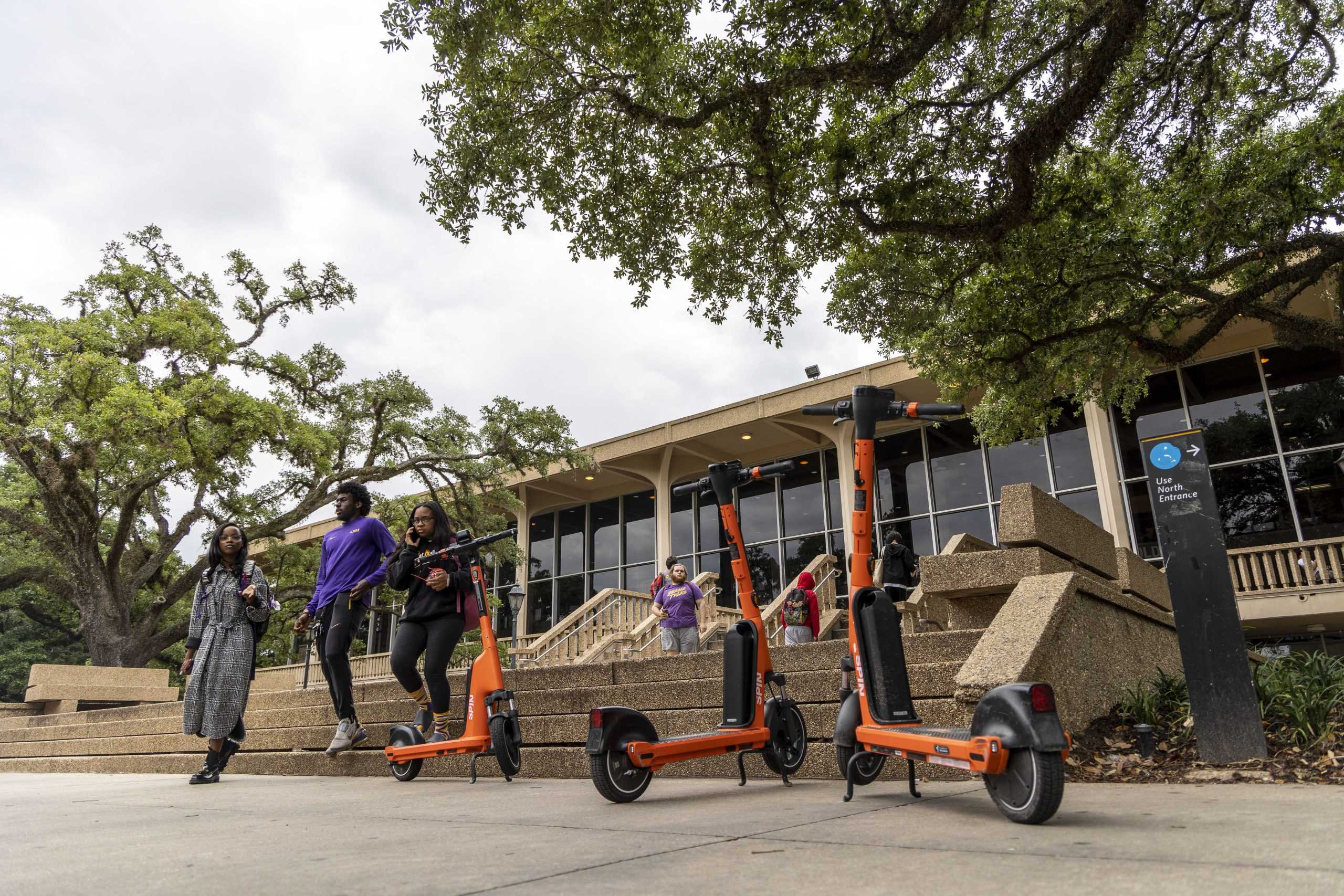 Quick Takes: What's the deal with those bright orange scooters all over campus?