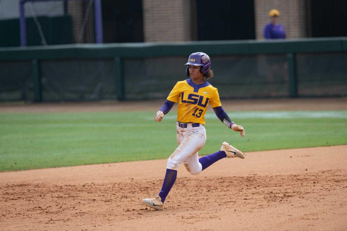 LSU softball junior infielder Daniel Coffey (13) hustles to second base Sunday, May 21, 2023, during LSU&#8217;s 7-4 loss against ULL in Game 6 of the NCAA Softball Regionals Championship at Tiger Park in Baton Rouge, La.