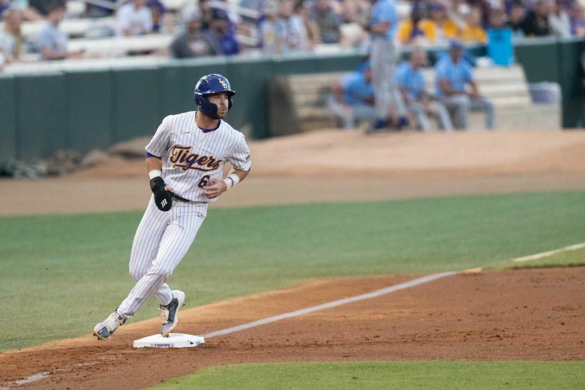 LSU baseball redshirt junior outfield Brayden Jobert (6) touches third base Tuesday, May 16, 2023, during LSU&#8217;s 7-4 win against McNeese State University at Alex Box Stadium in Baton Rouge, La.