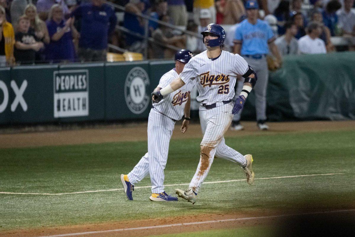 LSU baseball redshirt junior catcher Hayden Travinski (25) jogs to home base after hitting a home run Tuesday, May 16, 2023, during LSU&#8217;s 7-4 win against McNeese State University at Alex Box Stadium in Baton Rouge, La.