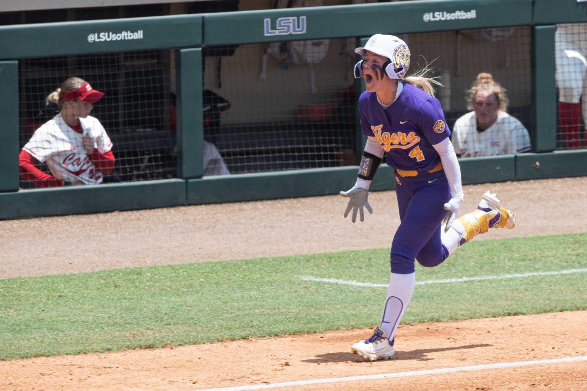 LSU softball sophomore outfielder McKenzie Redoutey (4) screams in happiness after scoring a home run Saturday, May 20, 2023, during LSU&#8217;s 4-0 win against ULL at Tiger Park in Baton Rouge, La.