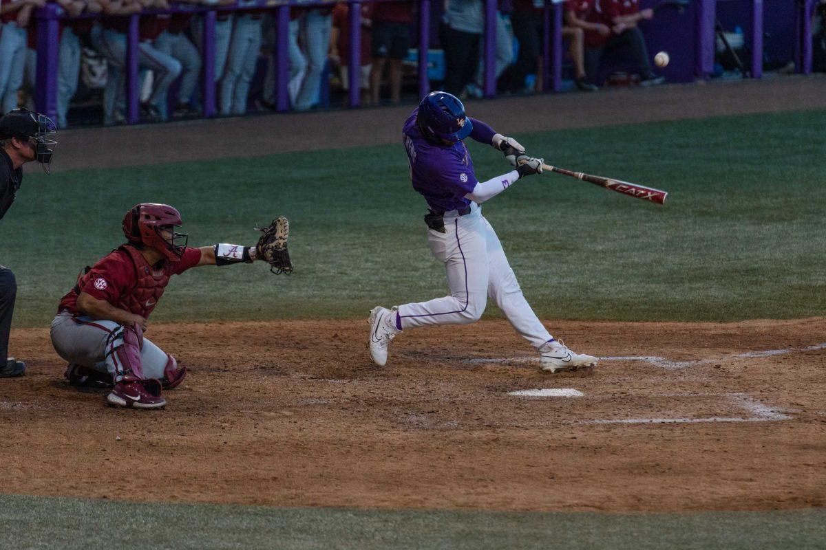 LSU baseball junior outfielder Dylan Crews (3) hits the ball on Friday, April 28, 2023, during LSU&#8217;s 8-6 win over Alabama at Alex Box Stadium in Baton Rouge, La.