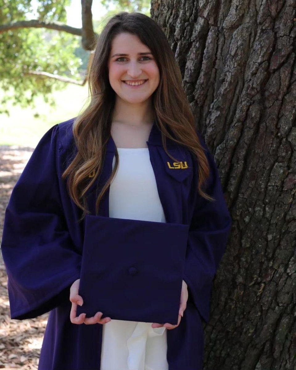 LSU senior, Sarah Sanchez, poses in her cap and gown.