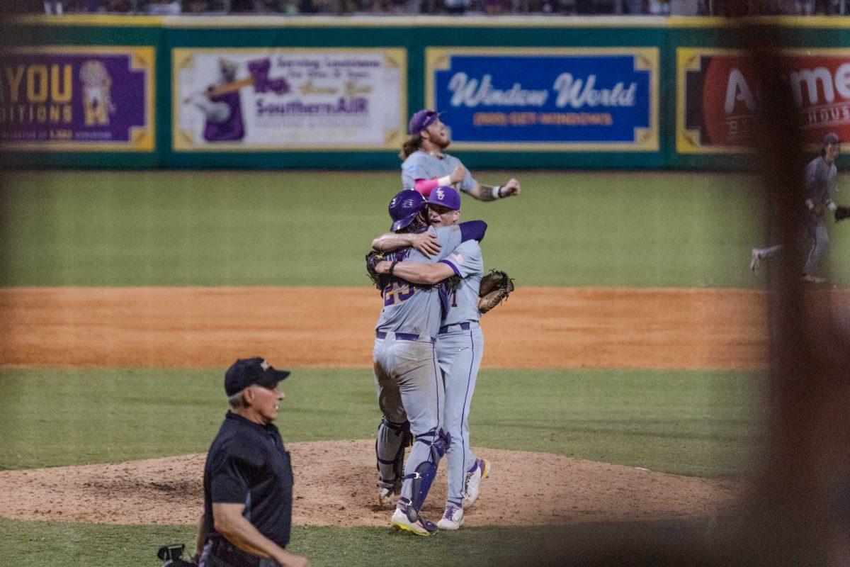 LSU baseball freshman pitcher Gavin Guidry (1) and redshirt junior catcher Hayden Travinski (25) hug on the field Sunday, June 11, 2023, after LSU&#8217;s 8-3 win against Kentucky at Alex Box Stadium in Baton Rouge, La.